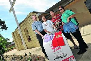HOLIDAY COMPASSION: Holy Trinity Church assistant priest Father Thomas Casanova, Lilia Turner, Patrick Cauban and Erlinda Pollack are hoping the Wagga community will come together to donate items to be sent to the Philippines. Picture: Les Smith