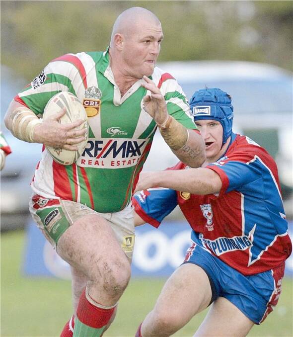 TAKING COMMAND: Giant Brothers prop Grant Wooden charges past Kangaroos hooker Lance George in the Group Nine game at Harris Park on Saturday. Wooden is set to replace Craig Field as captain-coach in 2009.