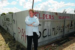 REVENGE PLOT: Lockhart's Dave Norton plans to embarass Elders by launching a public awareness campaign highlighting their failure to pay claims. His partner Rose O'Sullivan is pictured outside a fence he has used as a trial. Picture: Glenn Henderson