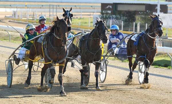 BEATEN: Jack Painting tries his best on the inside with Khanbelucky but is overtaken out wide by Nevada Sunrise to rob the 25-year-old of win number 100 at Wagga yesterday. Pictures: Les Smith