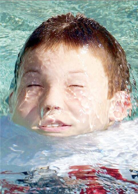COOLING OFF: Fraser Noack, 12, seeks refuge from the heat with a dip in the pool.
