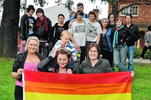 COLOURFUL CROWD: Kristy Davies (front, from left), Clare Easdown with Wesley, 10 months, and Melissa Martin are surrounded by Wagga residents in support of same-sex marriage. They will attend the August 18 rally in Wagga. Picture: Michael Frogley