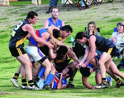 ROUGH STUFF: Players from Turvey Park and Wagga Tigers get up close and personal in yesterday's Riverina Football League elimination final at Narrandera Sportsground. Pictures: Glenn Henderson