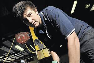 KEEN CONTRIBUTOR: New Wagga Greyhound Club committee member Nicholas Hull, 18, is busy at work at Graeme Hull Smash Repairs yesterday. Hull is looking forward to meeting the challenges of his new role on the committee. Picture: Michael Frogley