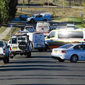 TRAGIC: Emergency services rush to the fatality on Plunkett Drive just in front of Mater Dei Catholic College yesterday. A 17-year-old boy died at the scene.  Picture: Addison Hamilton