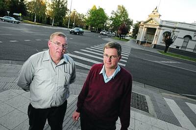 STREET SCENE: Matthew Lindqvist (left) and Andrew Doven from the Exclusive Brethren stand opposite Wagga City Council and the corner they used for street preaching for years. Picture: Les Smith