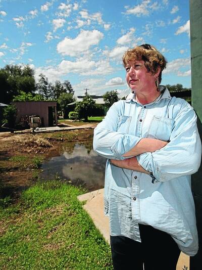DESTROYED: Lockhart's Rose O-Sullivan at the block where her house burnt down last year. Elders Insurance rejected the insurance claim because Rose's partner Dave Norton had a criminal conviction 20 years earlier. Picture: Glenn Henderson