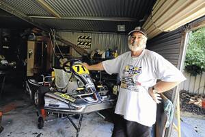 PIT LANE: Wagga kart racing enthusiast Laurie Doran does repairs to a kart at his Wagga home yesterday.