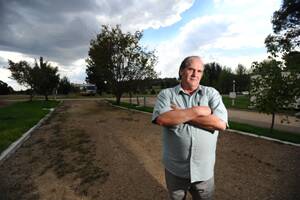 Horseshoe Motor Village owner Jim Williams stands at one of the many vacant blocks on his premises.