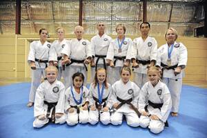 FISTS OF FURY: The Wagga Shinwa-Kai Karate Club – (back, from left) Hayley Stimson, Olivia Plane, Ray Martin, Dean Gregory, Margaret Plane, Sensei Sawal Salleh, Jeanette Gregory, (front, from left) Jasmin Plane, Hana Sawal, India Becroft, Tamera Rudd and Tanisha Melmoth – has returned from the Sydney International Karate Championships with a swag of medals and experience.