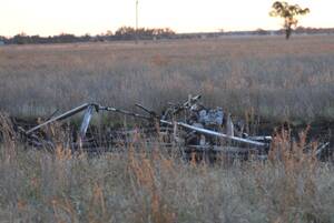 ALL THAT REMAINS: The charred remains of the light aircraft that crashed at Temora this afternoon. Picture: Oscar Colman