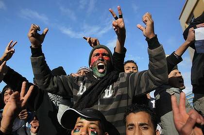 Rage  ... demonstrators demand the removal of the Libyan leader, Muammar Gaddafi, on Thursday. The east of the country has largely fallen  under opposition control.