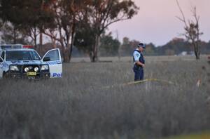 INVESTIGATION: Police investigate the scene north of Temora airport where a man was killed when his light aircraft crashed into a paddock off Research Road. Picture: Oscar Colman