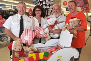 GIFT OF GIVING: (From left) Salvation Army representative Ian Shelley, mayoress Di Pascoe, Salvation Army representative Byron Bootes and Wagga K-Mart Wishing Tree co-ordinator Virginia Auld get together to launch the K-Mart Wishing Tree gift appeal yesterday. Picture: Sara Schneider