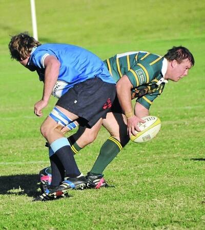 DECEPTION:  Ag College player Suart Geard (right) wrong-foots Waratahs opponent George Flannery at Conolly Rugby Complex on Saturday.