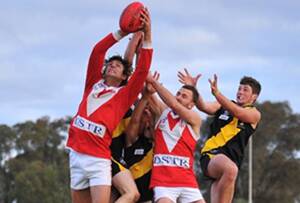 FLYING HIGH: Collingullie-Ashmont-Kapooka ruckman Josh Meiselbach rises above the pack to take a big mark in the Riverina Football League game at Gumly Oval on Saturday. Picture: Addison Hamilton