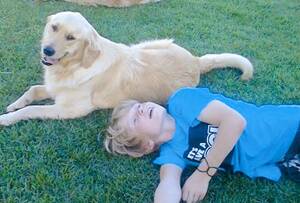 PLAYFUL BOY: Jayden Livingstone, 11, loved to play with his dogs Ellie and Benny.