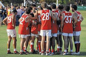 THE REAL DEAL: Collingullie-Ashmont-Kapooka players huddle to listen to coach Shane Lenon at three-quarter-time of its game against Narrandera earlier this year. Picture: Addison Hamilton
