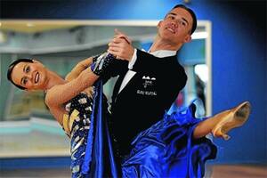 DANCING FOR CHANGE: Former Wagga residents and Australian ballroom dancing champions Anna Longmore and Matthew Rooke were ejected from the Australian Dancesport Championships after wearing a yellow sash in silent protest for their dancing peers who had been banned from competing at the event.