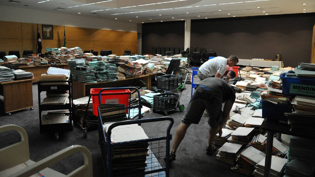 Employees ensure Wagga City Council records are stored in safety. Picture: Michael Frogley