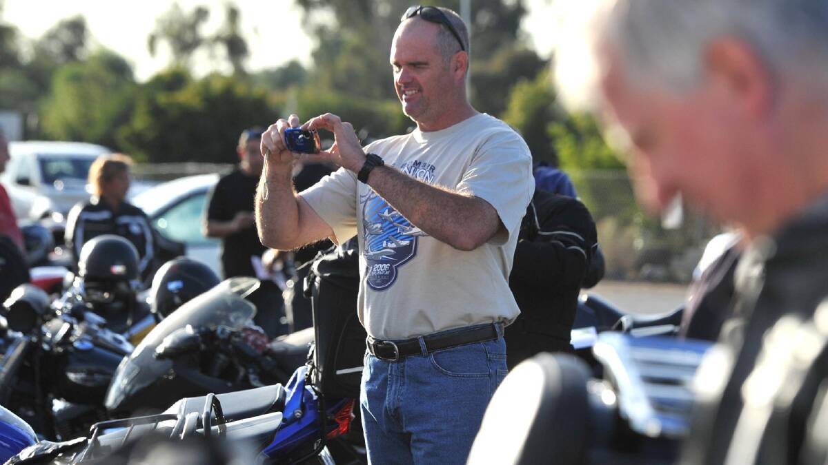 Motorcycle ride for motor neurone disease. Bryce McDonell of Wagga appreciates the other bikes. Picture: Les Smith