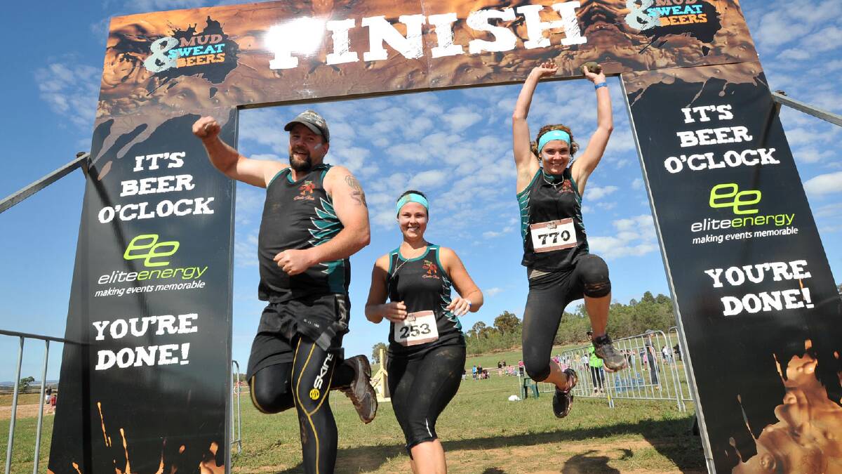 Mud, Sweat and Beers. David Paull, Courtney Gash and Jasmin Watt are relieved to cross the finish line. Picture: Michael Frogley