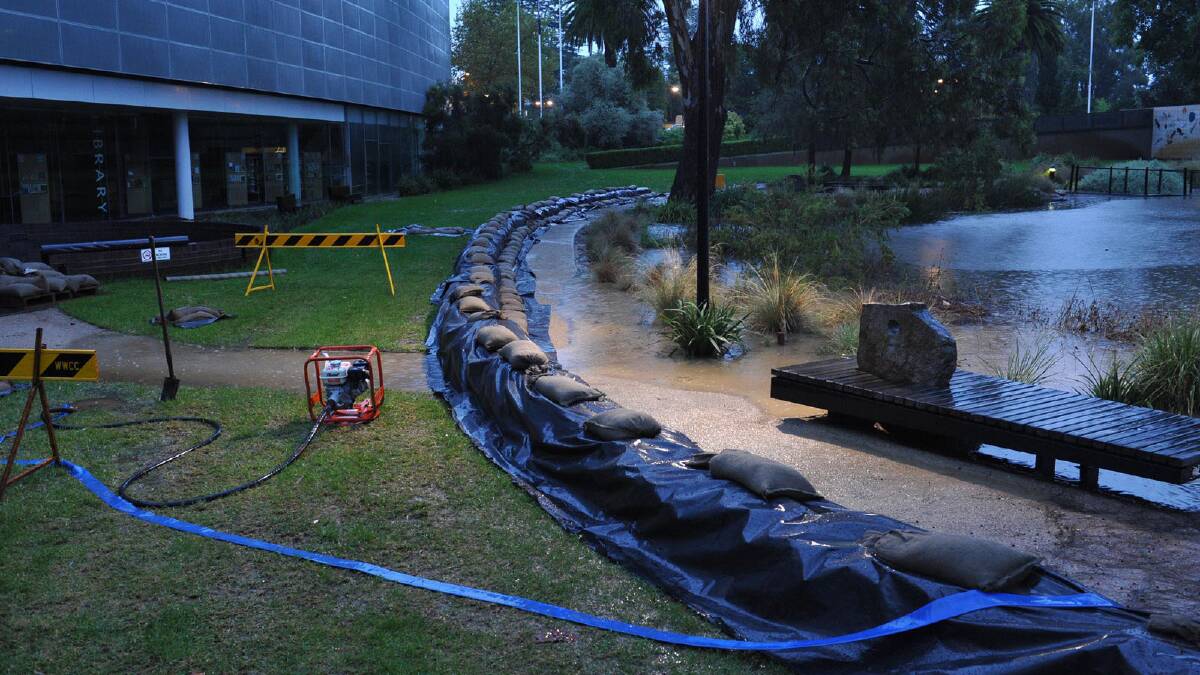 Water fills Wollundry Lagoon and floods the Civic Precinct. Picture: Michael Frogley