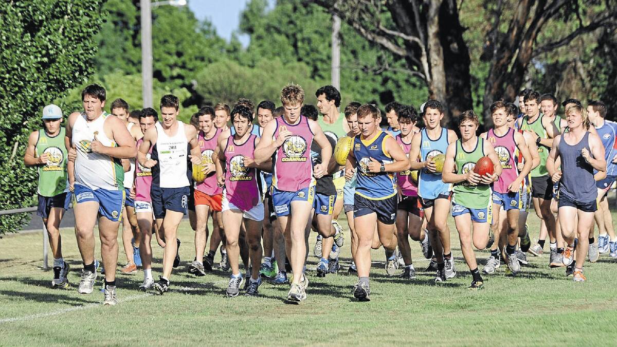 HARD YARDS: MCUE players hit the track at the club’s first training session at Apex Park on Tuesday night. Pictures: Les Smith