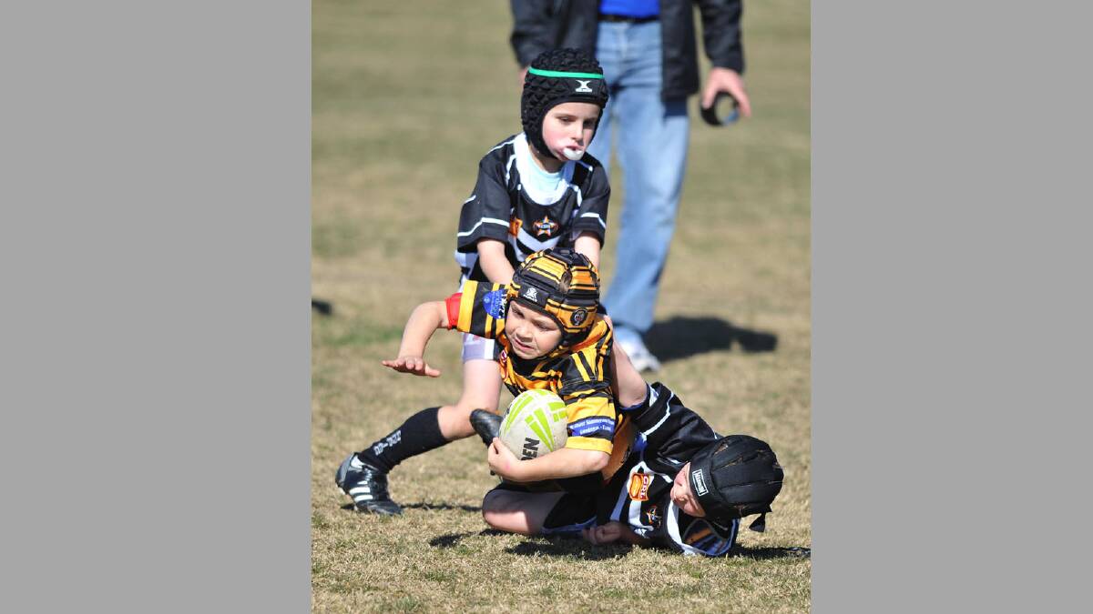 Junior rugby league. Gundagai Adelong v Wagga Magpies. Wagga's David Morgan and Sam Davidson with Gundagai Adelong's Cooper Bethune. Picture: Alastair Brook