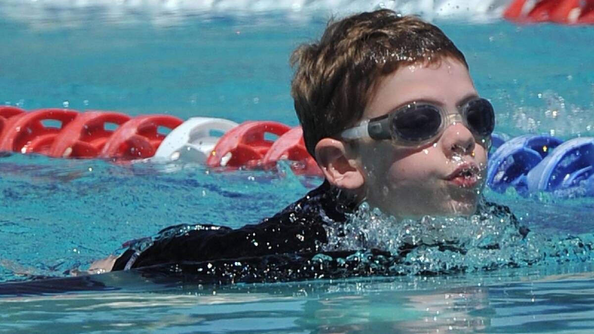 Ethan Millie, 9, wins his junior 50m breast stroke. Picture: Michael Frogley 