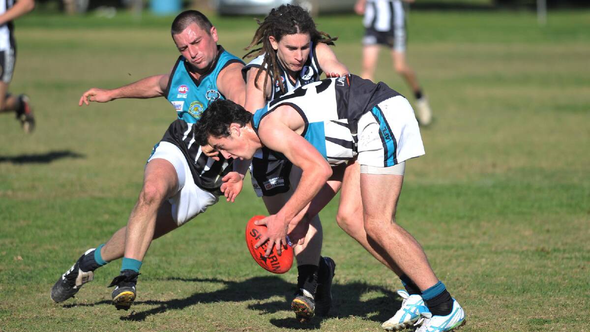 Farrer League. TRYC v Northern Jets. Northern Jets' Ben Prentice and Lachlan Flagg and TRYC's Bryan Ball. Picture: Alastair Brook