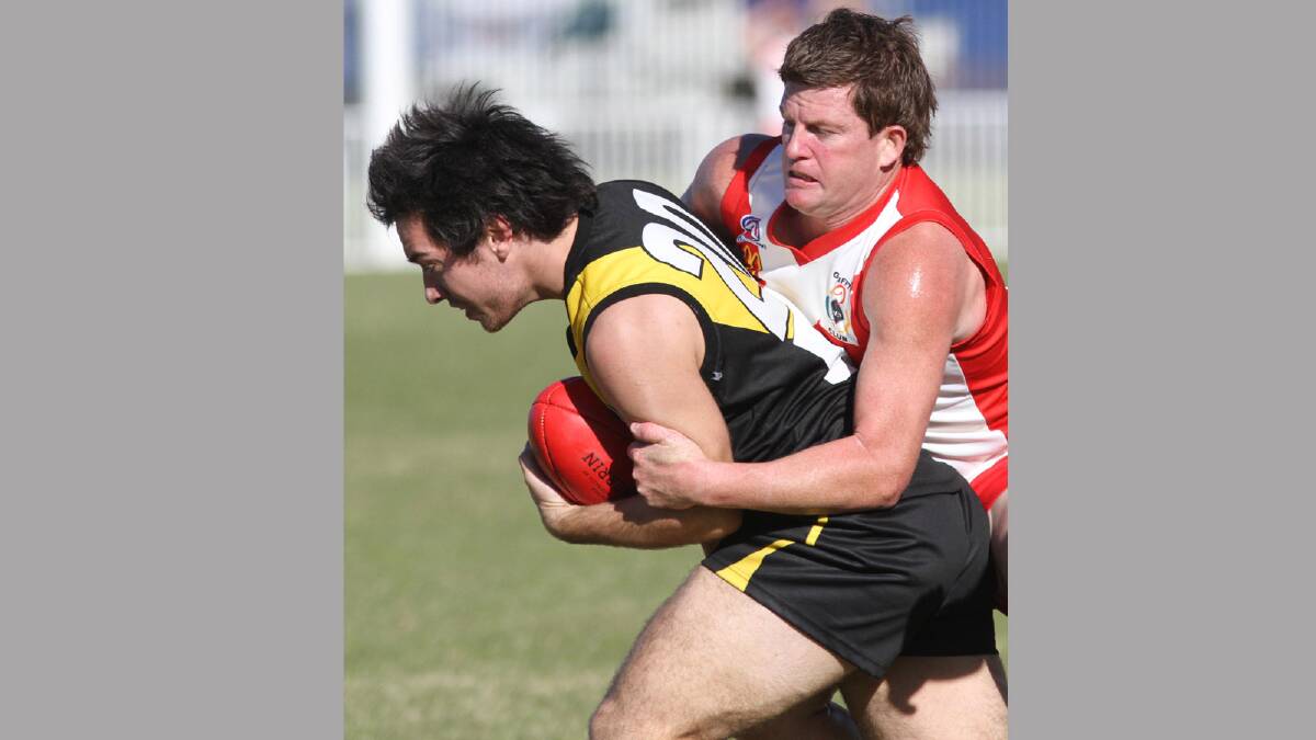RFL. Griffith Swans v Wagga Tigers. Wagga's Josh Larwood and Griffith's Michael Duncan. Picture: Les Smith