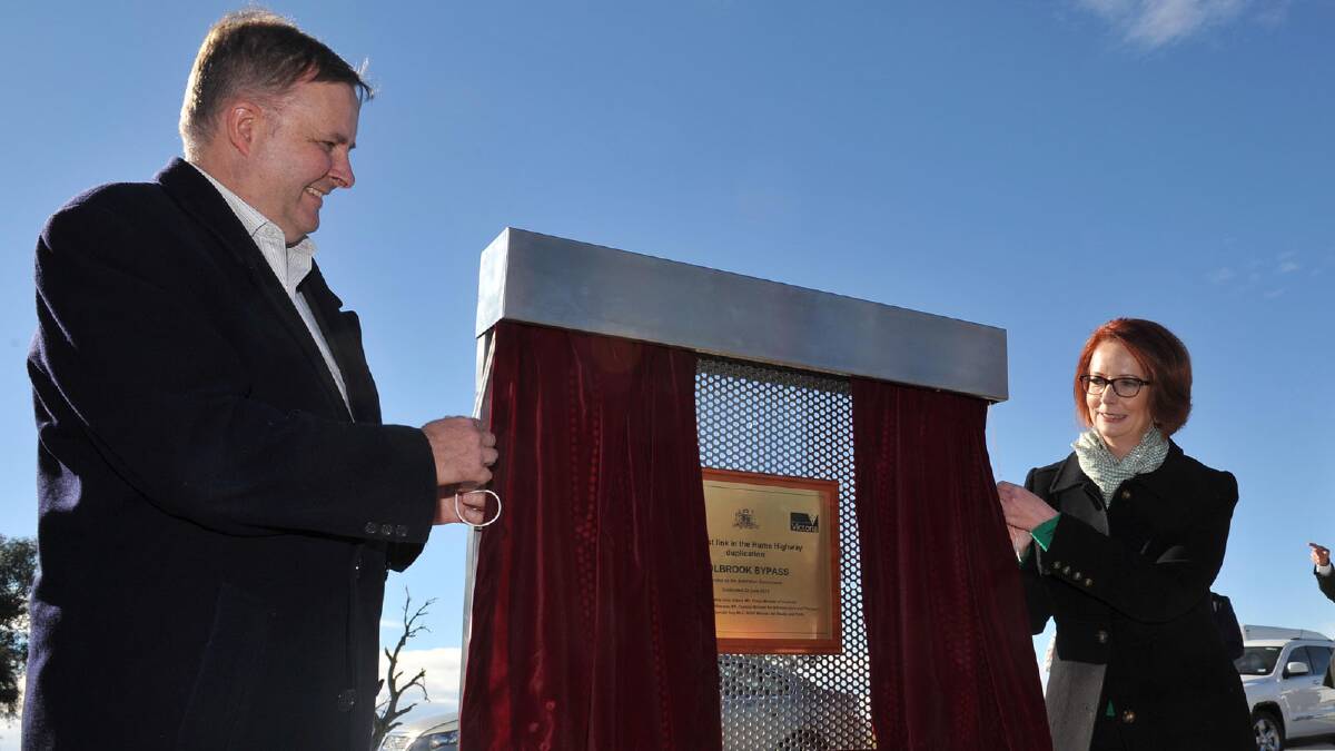 Minister for Infrastructure and Transport Anthony Albanese and Prime Minister Julia Gillard unveil the plaque. Picture: Michael Frogley