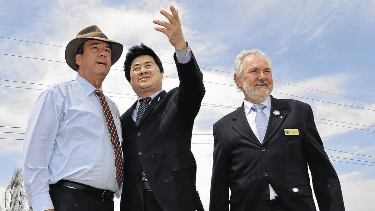 LOOKING AHEAD: (from left) Member for Wagga Daryl Maguire joins Wuai Group representative Zhaoxiang Jin and Wagga mayor Rod Kendall at the corner of Copland Street and Kooringal Road. 