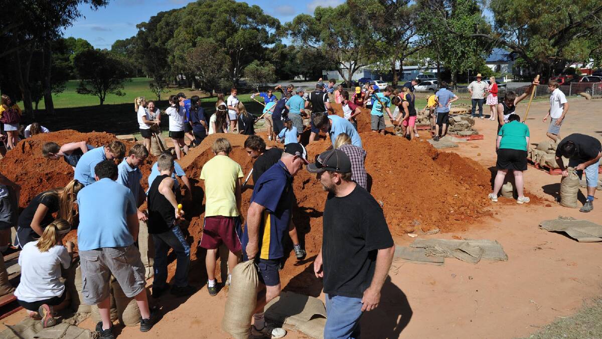 Narrandera High School students fill sandbags. Picture: Michael Frogley