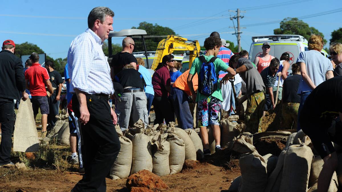 Premier Barry O'Farrell visited the SES headquarters where residents were filling sandbags. Picture: Addison Hamilton