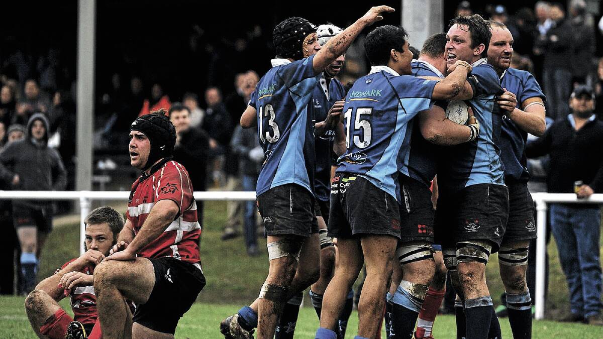 ONE MOMENT: CSU players Mitch Fealy and Pat Hunter look for confirmation of their shattered SIRU grand final hopes as Waratahs players rush to celebrate Harry Cook’s winning try at Conolly Rugby Complex on Saturday. Picture: Addison Hamilton