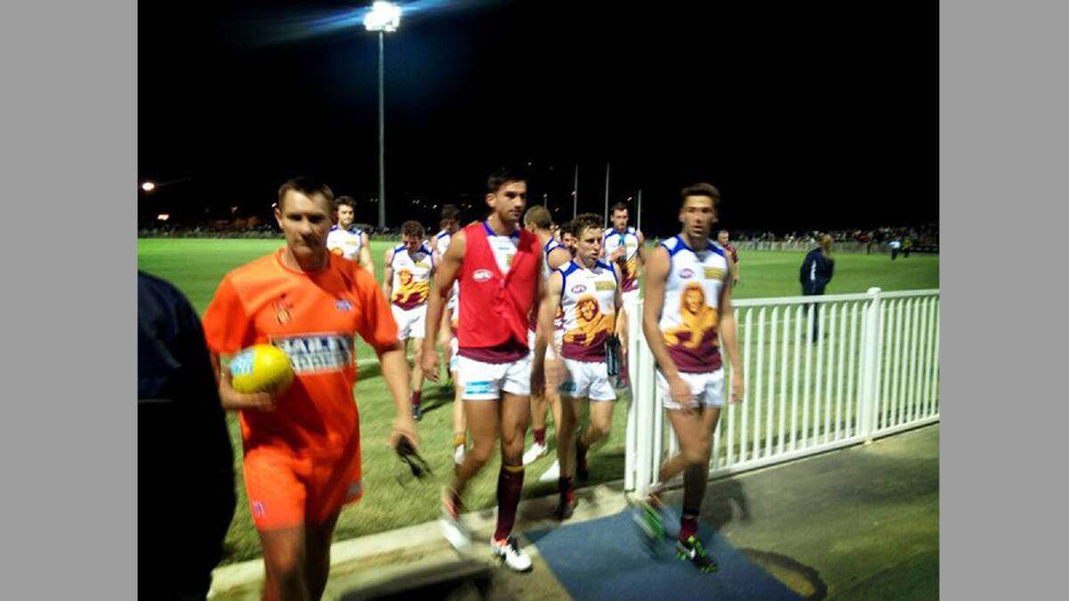 The Brisbane Lions emerge from the field victorious after their win over GWS Giants at Robertson Oval tonight. Picture: AFLNSWACT (@aflnswact) via Twitter