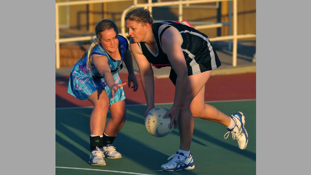 First grade netball. Panthers v New Kids Aces. New Kids' Brodie Jaques and Panthers' Kirsty Lowe. Picture: Addison Hamilton