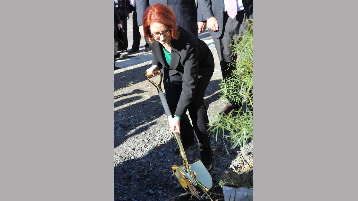 Prime Minister Julia Gillard plants a tree at the southern end of the bypass. Picture: Michael Frogley