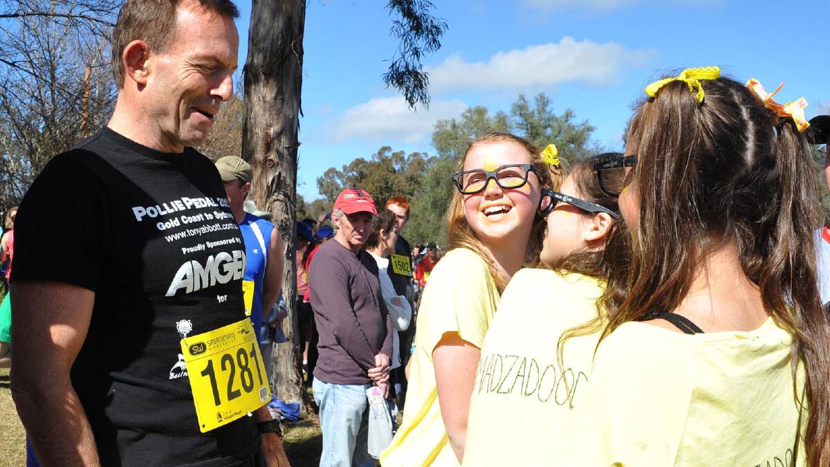Opposition Leader Tony Abbott with (from left) Poppy Warden, Maddie Kelly and Abbey Corbett, all 12. Picture: Sara Schneider