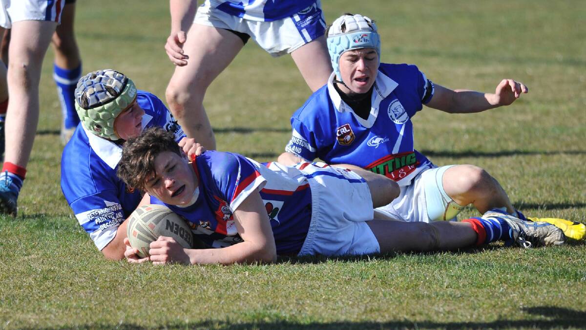 Junior rugby league. Turvey Park v Cootamundra. Turvey Park's Jack Strutt scores a try in front of Cootamundra's Luke Levett and Blake Guthrie. Picture: Alastair Brook
