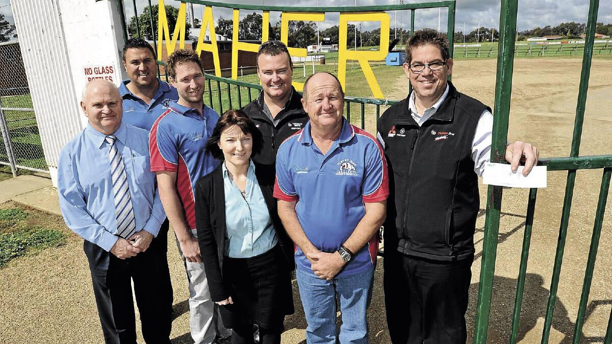GOING FORWARD: Turvey Park is gearing up for a big season in 2014 as it announced its coach and major sponsors for next year at Maher Oval yesterday. Pictured (from left) are The Rules Club general manager Jack Jolley, player Stephen Smith, captain-coach Chris Cerato, The Rules Club business manager Renee Tonkin, Thomas Bros sales manager used cars Danny Crouch, Turvey Park president Vin Carroll and Thomas Bros sales manager Wayne Gardner. 	Picture: Les Smith