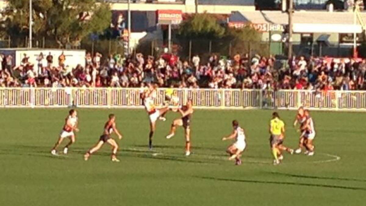 The first bounce between the GWS Giants and Brisbane Lions.