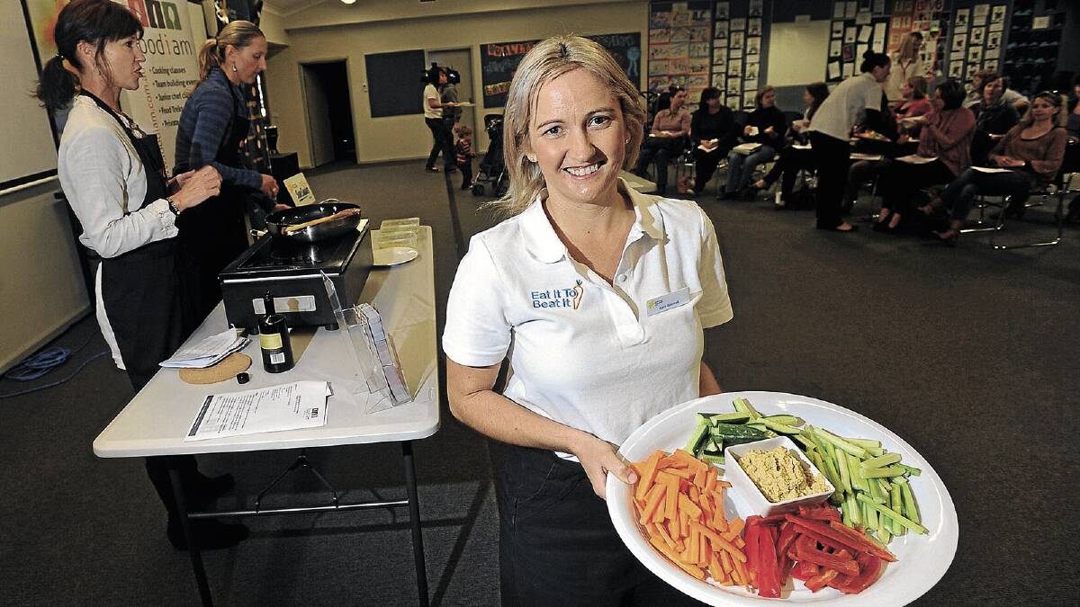 PLATE UP: Eat It To Beat It organiser Avril Grintell displays a plate of healthy food at a Cancer Council campaign kicking off at Lutheran Primary School, where parents discovered ways to implement a better diet for their children. Picture: Addison Hamilton