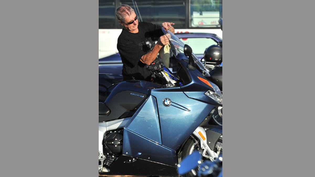 Motorcycle ride for motor neurone disease. John Watson of Wagga gives his bike a last minute clean. Picture: Les Smith