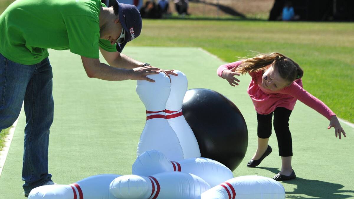 Headspace music festival for Youth Week. Matthew Land of Headspace and Mary-Joelle Delbecq of Wagga and some inflatable ten-pins. Picture: Les Smith
