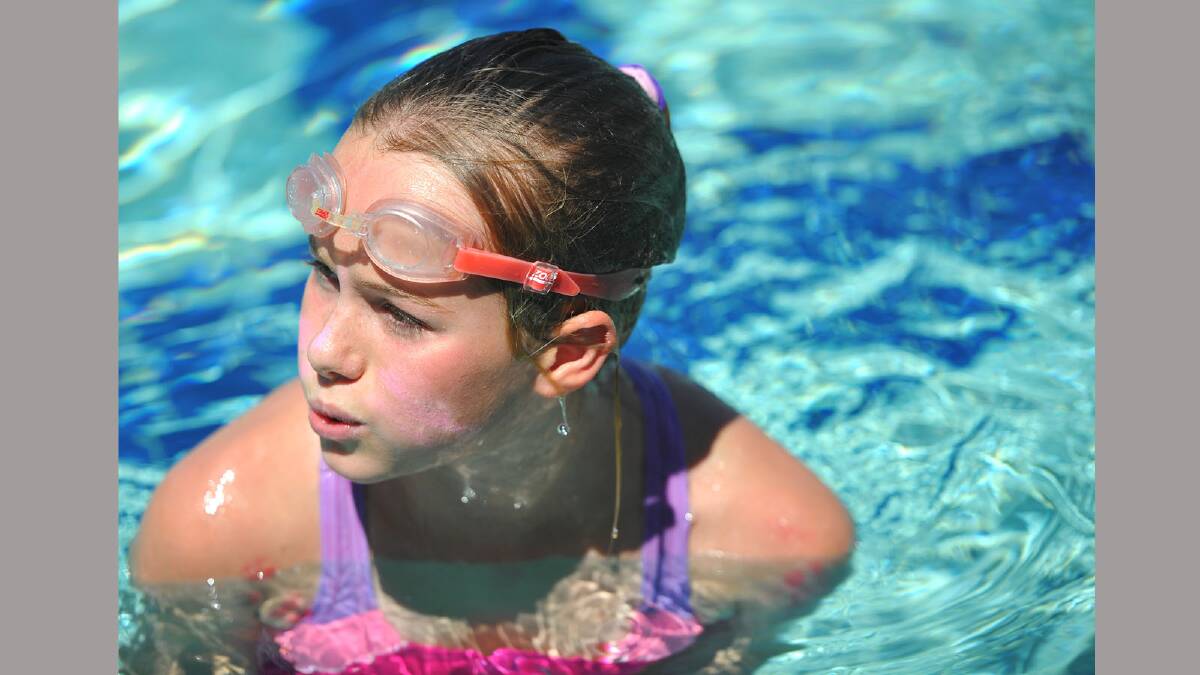 Lauren Harris, 10, after winning her backstroke heat. Picture: Addison Hamilton