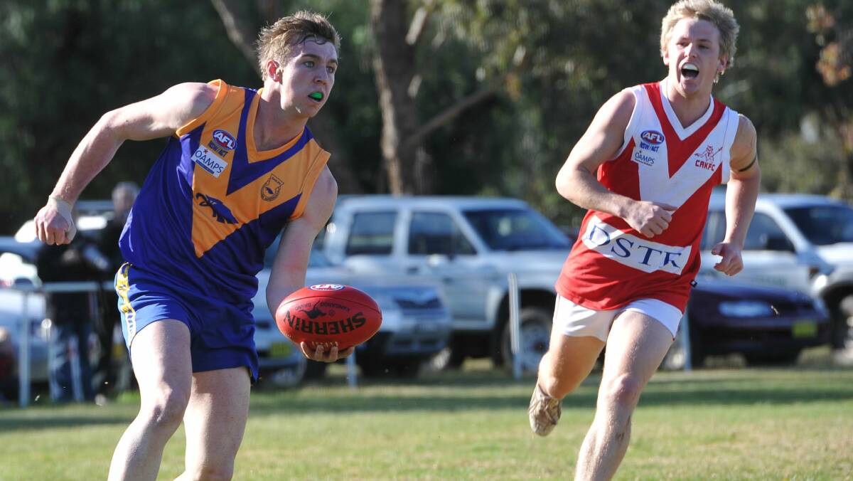 SWITCH: Jed Hillman looks to dish off a handball for Narrandera against Collingullie-Ashmont-Kapooka last year. He has jumped across to the Demons for next season. 
