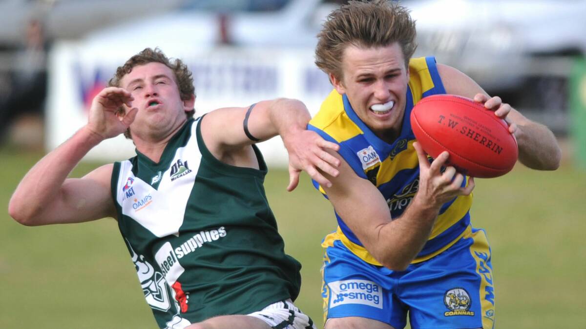BIG LOSS: Mangoplah-Cookardinia United-Eastlakes' Ryan Price takes a mark in front of Coolamon's Marshall Macauley. Price is off overseas in January. Picture: Les Smith